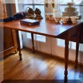 F19. Drop leaf table with turned legs. 